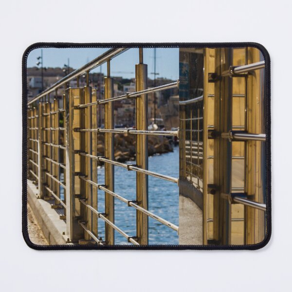 Item preview, Stainless Steel Railing Along Marina Waterfront Promenade With Blue Sea Reflections And Sunny Walkway designed and sold by Nmallia.