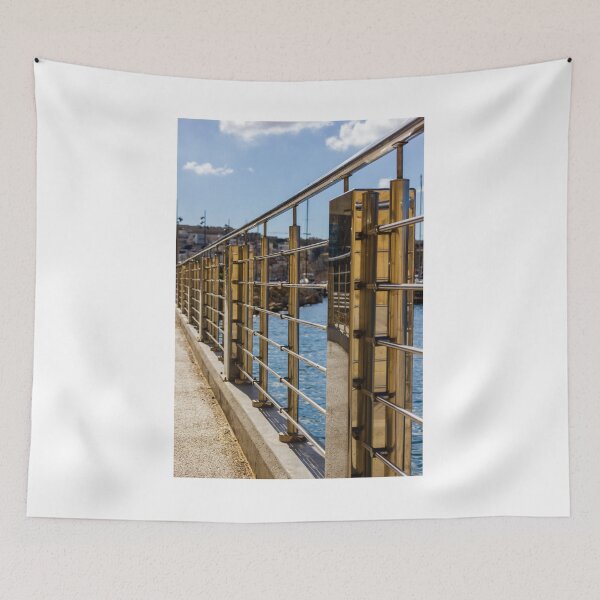 Item preview, Stainless Steel Railing Along Marina Waterfront Promenade With Blue Sea Reflections And Sunny Walkway designed and sold by Nmallia.