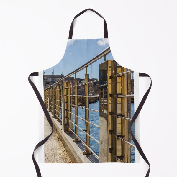Item preview, Stainless Steel Railing Along Marina Waterfront Promenade With Blue Sea Reflections And Sunny Walkway designed and sold by Nmallia.