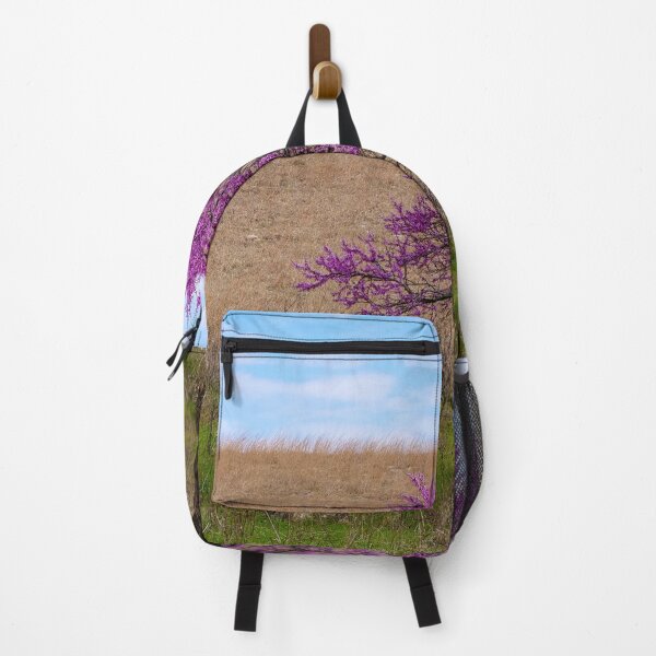 Item preview, Solitary Redbud tree with green grass and dried prairie background. designed and sold by South 500 Photography.