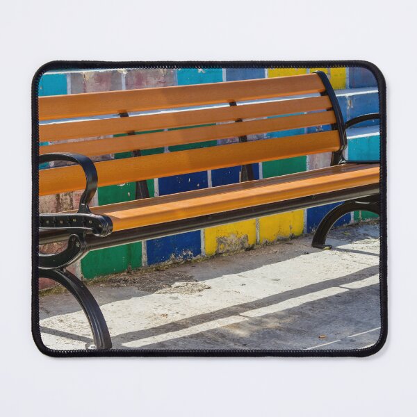 Item preview, Empty Wooden Bench Against Colorful Tiled Steps in Sunny Outdoor Urban Park designed and sold by Nmallia.