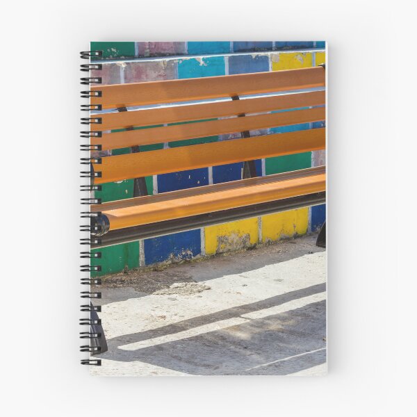 Item preview, Empty Wooden Bench Against Colorful Tiled Steps in Sunny Outdoor Urban Park designed and sold by Nmallia.