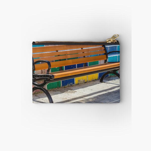 Item preview, Empty Wooden Bench Against Colorful Tiled Steps in Sunny Outdoor Urban Park designed and sold by Nmallia.