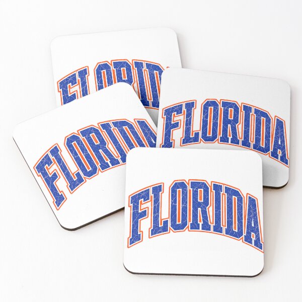 Item preview, A distressed varsity design featuring FLORIDA in bold collegiate block lettering with a muted blue‑orange palette inspired by Florida’s coastal heritage designed and sold by ashofthesouth.