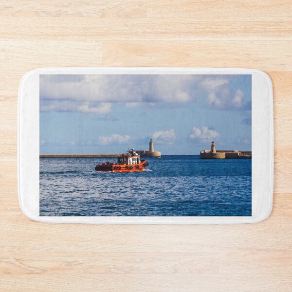 Item preview, Orange Pilot Boat Leaving Harbor With Lighthouse And Breakwater On Calm Blue Sea designed and sold by Nmallia.