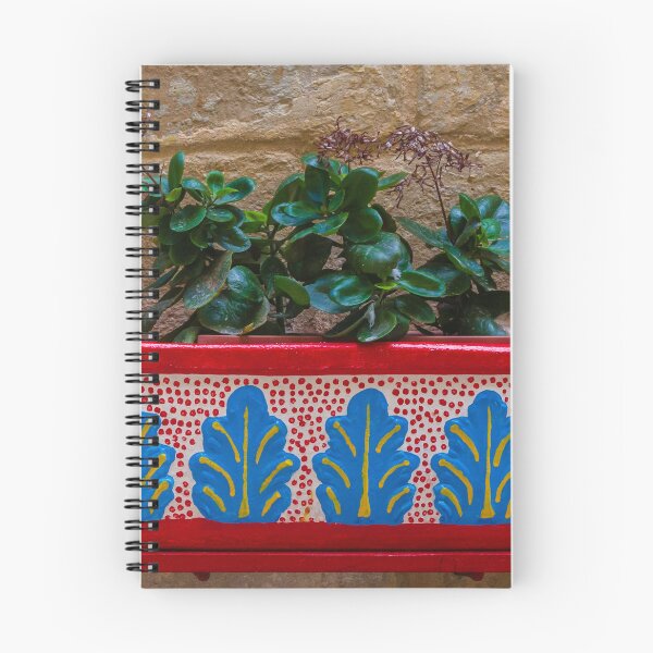 Item preview, Colorful Painted Planter With Green Succulent Against A Textured Stone Wall designed and sold by Nmallia.