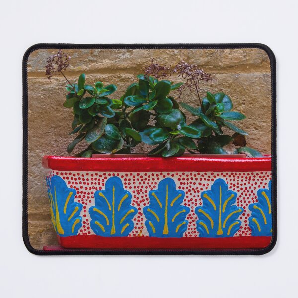 Item preview, Colorful Painted Planter With Green Succulent Against A Textured Stone Wall designed and sold by Nmallia.