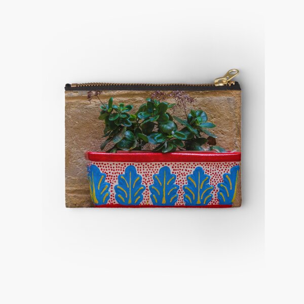 Item preview, Colorful Painted Planter With Green Succulent Against A Textured Stone Wall designed and sold by Nmallia.
