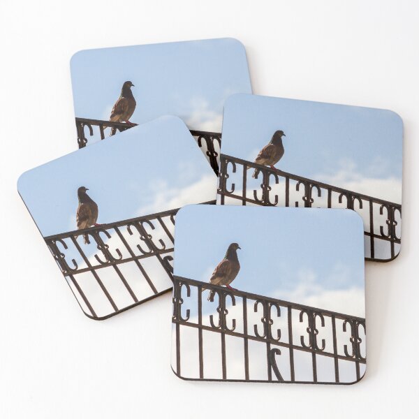 Item preview, Pigeon Perched on Ornate Metal Fence Against Blue Sky — Urban Bird Silhouette on Railing designed and sold by Nmallia.