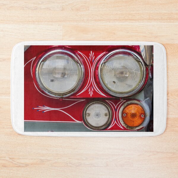 Item preview, Close-Up Of Vintage Red Car Headlights With Pinstripe Detail And Classic Turn Signal Lights designed and sold by Nmallia.
