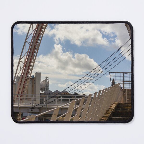 Item preview, Modern Arch Bridge With Stairs and Railing Over Harbor Water Under Dramatic Cloudy Sky designed and sold by Nmallia.