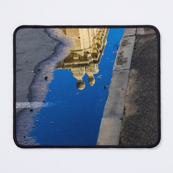 Item preview, Architectural Reflection in Puddle on Urban Street With Blue Sky and Historic Building Details designed and sold by Nmallia.