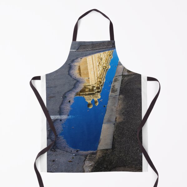 Item preview, Architectural Reflection in Puddle on Urban Street With Blue Sky and Historic Building Details designed and sold by Nmallia.
