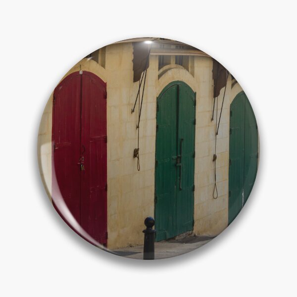 Item preview, Row Of Colorful Arched Wooden Doors On Stone Building Facade With Weathered Awnings designed and sold by Nmallia.