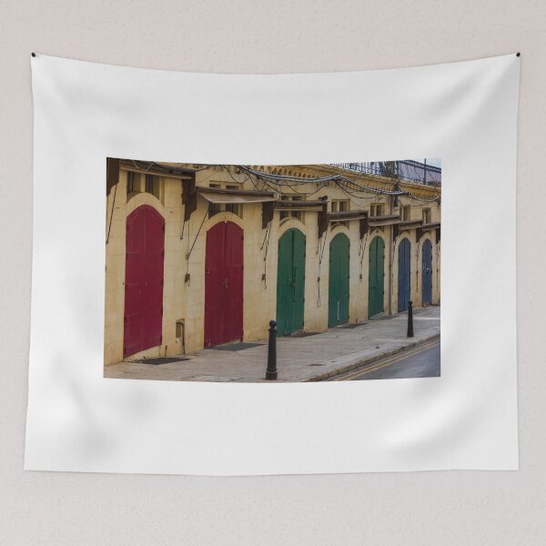 Item preview, Row Of Colorful Arched Wooden Doors On Stone Building Facade With Weathered Awnings designed and sold by Nmallia.