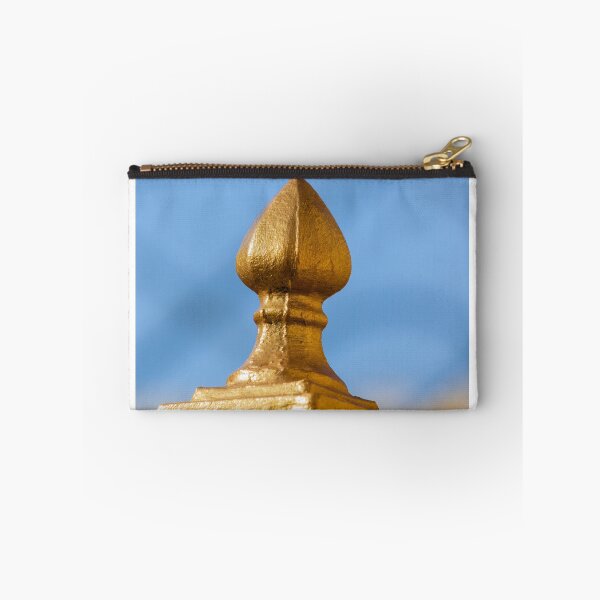 Item preview, Golden Finial Fence Post Close-Up Against Blue Sky – Gilded Decorative Metal Railing Detail designed and sold by Nmallia.