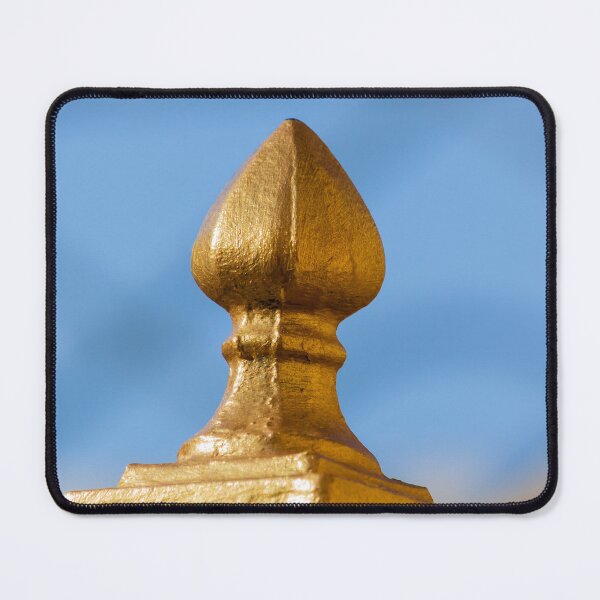 Item preview, Golden Finial Fence Post Close-Up Against Blue Sky – Gilded Decorative Metal Railing Detail designed and sold by Nmallia.