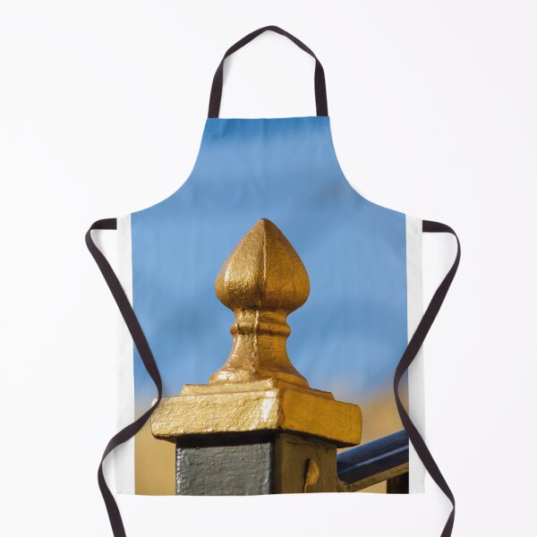 Item preview, Golden Finial Fence Post Close-Up Against Blue Sky – Gilded Decorative Metal Railing Detail designed and sold by Nmallia.