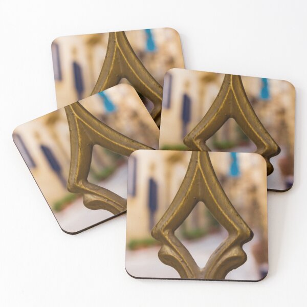 Item preview, Brass Finial Close-Up on Ornate Fence With Shallow Street Bokeh and Warm Mediterranean Tones designed and sold by Nmallia.