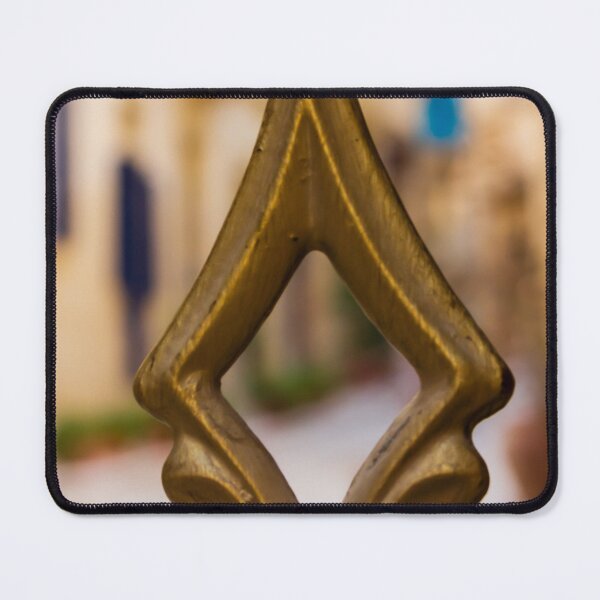 Item preview, Brass Finial Close-Up on Ornate Fence With Shallow Street Bokeh and Warm Mediterranean Tones designed and sold by Nmallia.