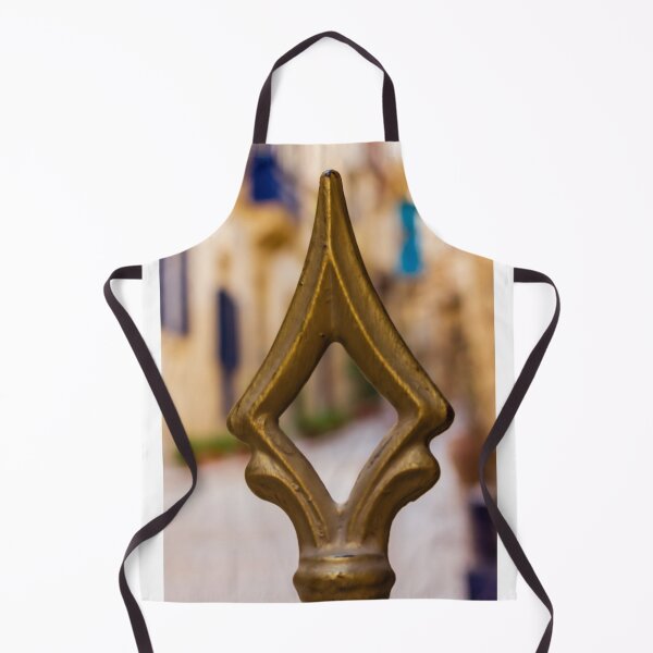 Item preview, Brass Finial Close-Up on Ornate Fence With Shallow Street Bokeh and Warm Mediterranean Tones designed and sold by Nmallia.