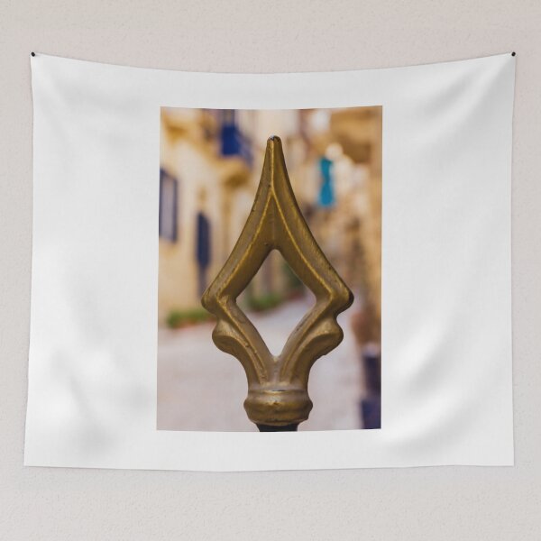 Item preview, Brass Finial Close-Up on Ornate Fence With Shallow Street Bokeh and Warm Mediterranean Tones designed and sold by Nmallia.
