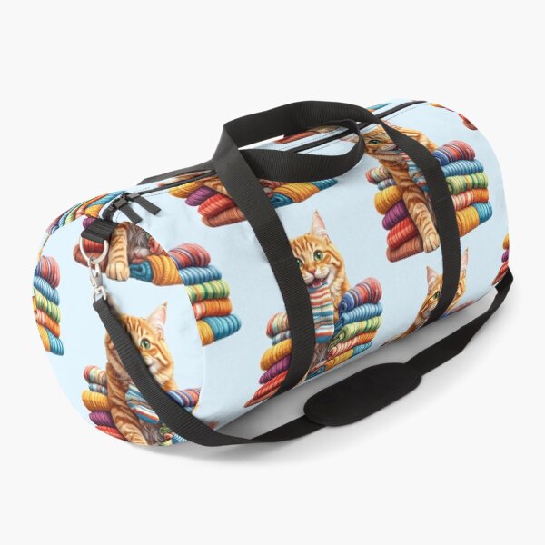 Item preview, Cute Ginger Cat Carrying a Colorful Sock Between Folded Towels Sticker designed and sold by OksArtStudio.