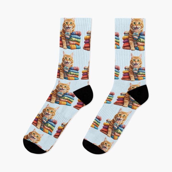 Item preview, Cute Ginger Cat Carrying a Colorful Sock Between Folded Towels Sticker designed and sold by OksArtStudio.