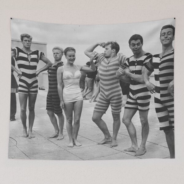 Item preview, Funny Boys flexing muscles at the Beach vintage black and white swimsuit photograph art print designed and sold by Astrid Arkhangelsky.