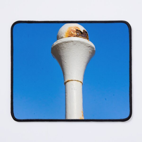 Item preview, Weathered White Metal Post With Rusty Ball Finial Against Clear Blue Sky, Close-Up Architectural Detail designed and sold by Nmallia.