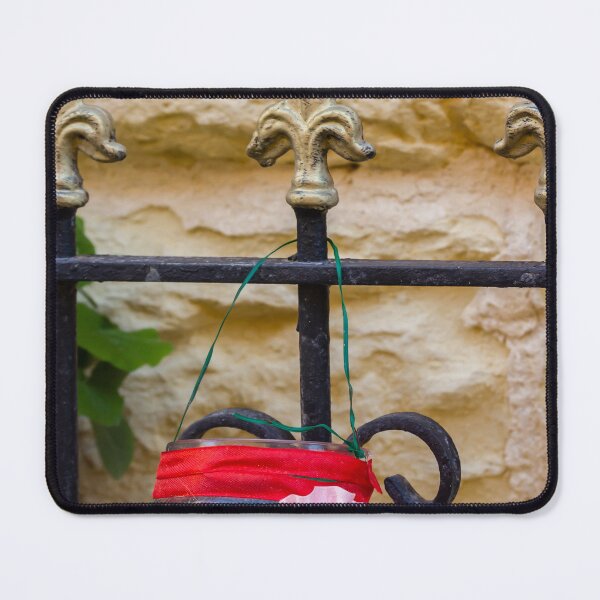 Item preview, Decorative Hanging Jar With Fabric Flowers on Iron Fence Near Stone Wall designed and sold by Nmallia.