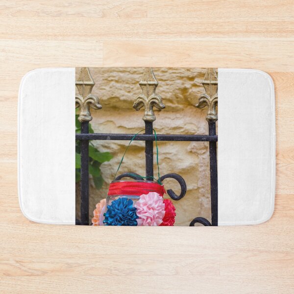 Item preview, Decorative Hanging Jar With Fabric Flowers on Iron Fence Near Stone Wall designed and sold by Nmallia.