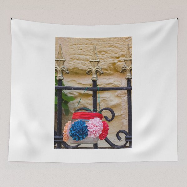 Item preview, Decorative Hanging Jar With Fabric Flowers on Iron Fence Near Stone Wall designed and sold by Nmallia.