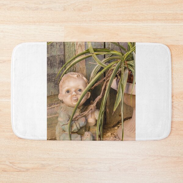 Item preview, Vintage Porcelain Doll Beside Spider Plant and Weathered Wooden Wall in Rustic Abandoned Setting designed and sold by Nmallia.