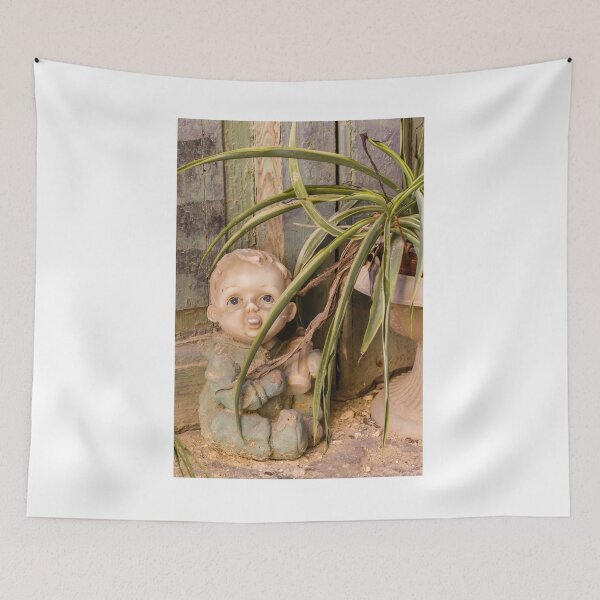 Item preview, Vintage Porcelain Doll Beside Spider Plant and Weathered Wooden Wall in Rustic Abandoned Setting designed and sold by Nmallia.