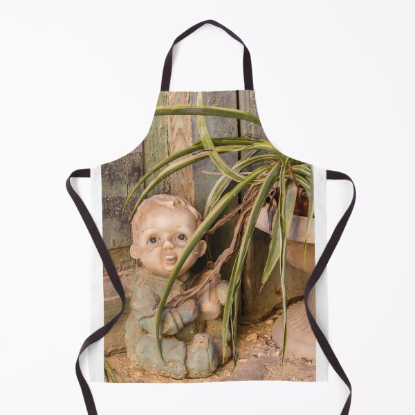 Item preview, Vintage Porcelain Doll Beside Spider Plant and Weathered Wooden Wall in Rustic Abandoned Setting designed and sold by Nmallia.