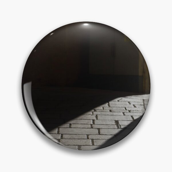 Item preview, Diagonal Sunlight on Cobblestone Alleyway Casting Dramatic Shadow in Narrow Urban Passage designed and sold by Nmallia.
