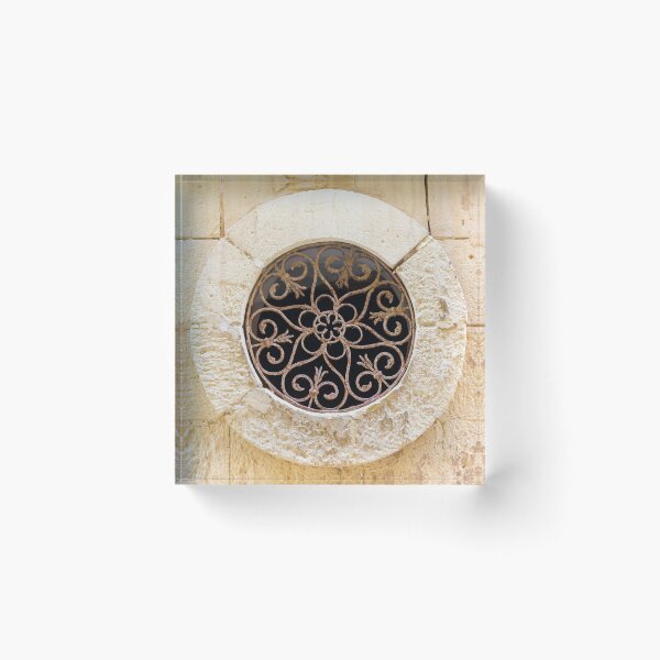 Item preview, Ornamental Round Window With Wrought Iron Grille Set In A Weathered Stone Wall designed and sold by Nmallia.