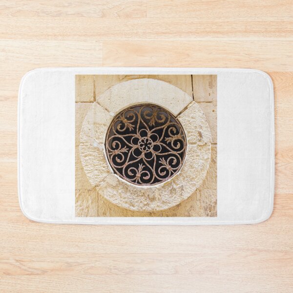 Item preview, Ornamental Round Window With Wrought Iron Grille Set In A Weathered Stone Wall designed and sold by Nmallia.