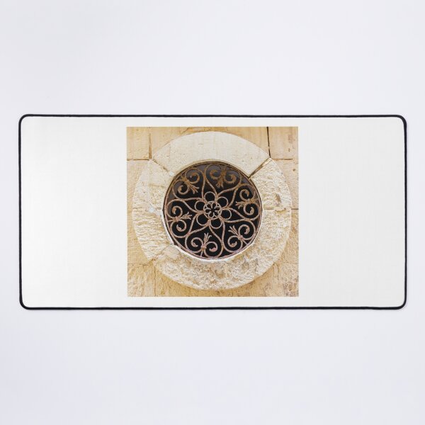 Item preview, Ornamental Round Window With Wrought Iron Grille Set In A Weathered Stone Wall designed and sold by Nmallia.