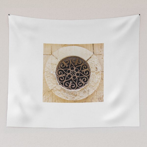 Item preview, Ornamental Round Window With Wrought Iron Grille Set In A Weathered Stone Wall designed and sold by Nmallia.