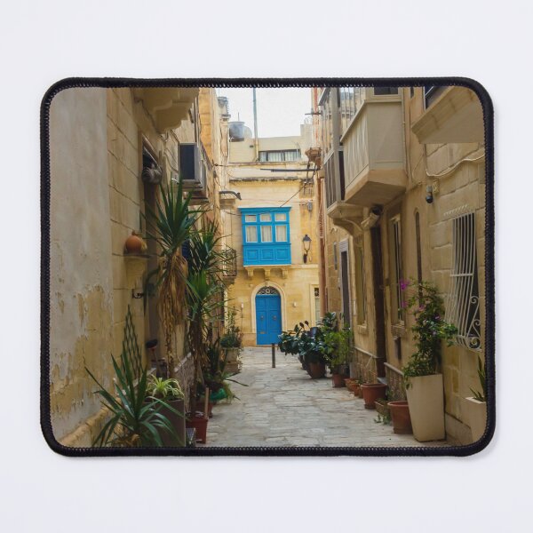 Item preview, Sunlit Narrow Mediterranean Alley With Blue Door, Stone Pavement, Potted Plants And Traditional Balconies designed and sold by Nmallia.
