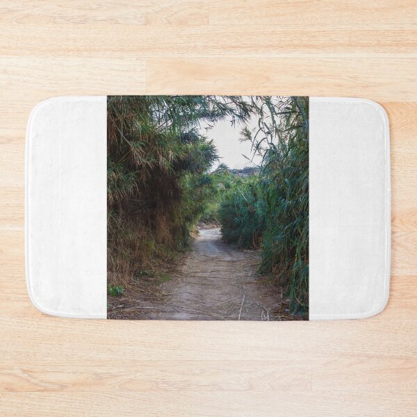 Item preview, Overgrown Reed Pathway Through Lush Vegetation Creating A Secluded Natural Trail And Green Tunnel designed and sold by Nmallia.