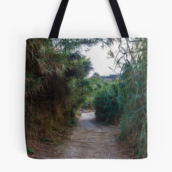 Item preview, Overgrown Reed Pathway Through Lush Vegetation Creating A Secluded Natural Trail And Green Tunnel designed and sold by Nmallia.