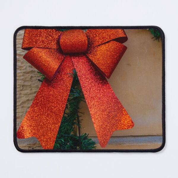 Item preview, Sparkling Red Bow Christmas Decoration On Green Garland Against Stone Wall For Holiday Display designed and sold by Nmallia.