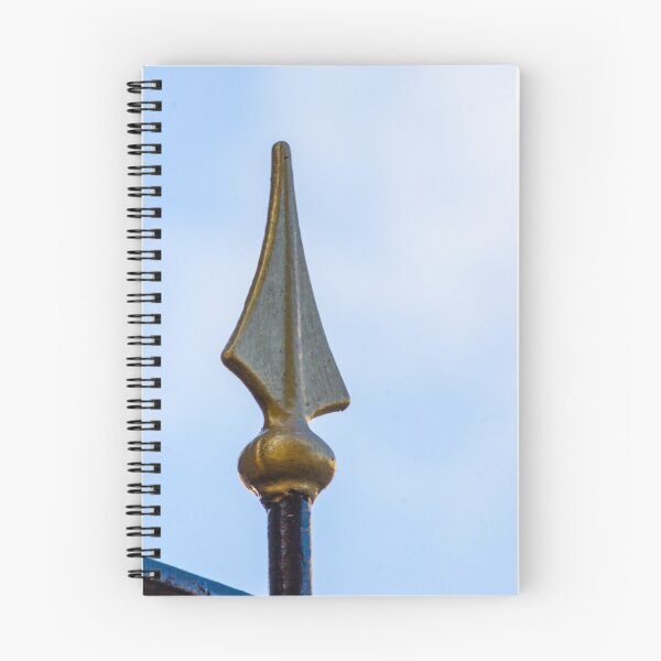 Item preview, Gold Metal Finial Spear Tip On Ornamental Fence Against Blue Sky, Decorative Iron Spike Closeup designed and sold by Nmallia.