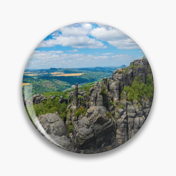 Item preview, Picturesque view of the Schrammsteine rock formations and the Falkenstein in the Saxon Switzerland National Park under a blue sky. designed and sold by Marc Alexander Kunze.