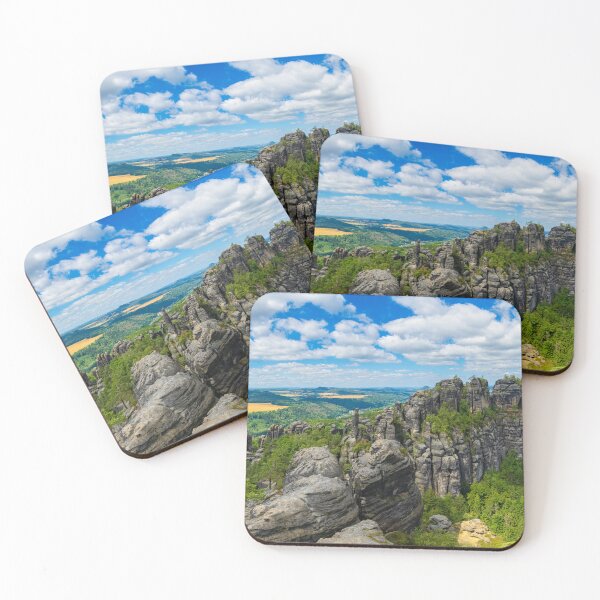 Item preview, Picturesque view of the Schrammsteine rock formations and the Falkenstein in the Saxon Switzerland National Park under a blue sky. designed and sold by Marc Alexander Kunze.