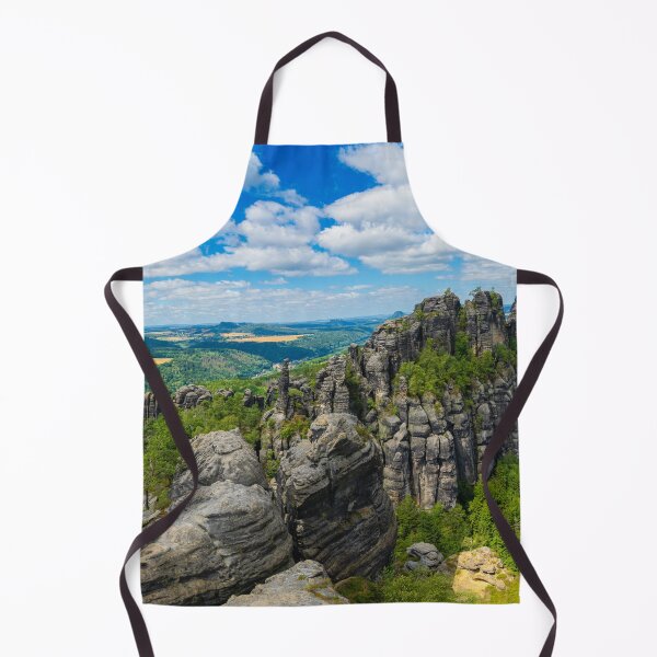 Item preview, Picturesque view of the Schrammsteine rock formations and the Falkenstein in the Saxon Switzerland National Park under a blue sky. designed and sold by Marc Alexander Kunze.