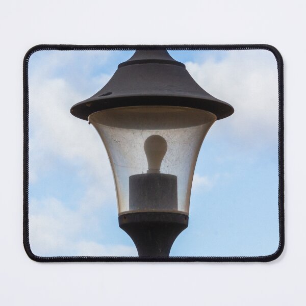 Item preview, Vintage Street Lamp Lantern With Bulb Against Blue Sky And Soft White Clouds designed and sold by Nmallia.